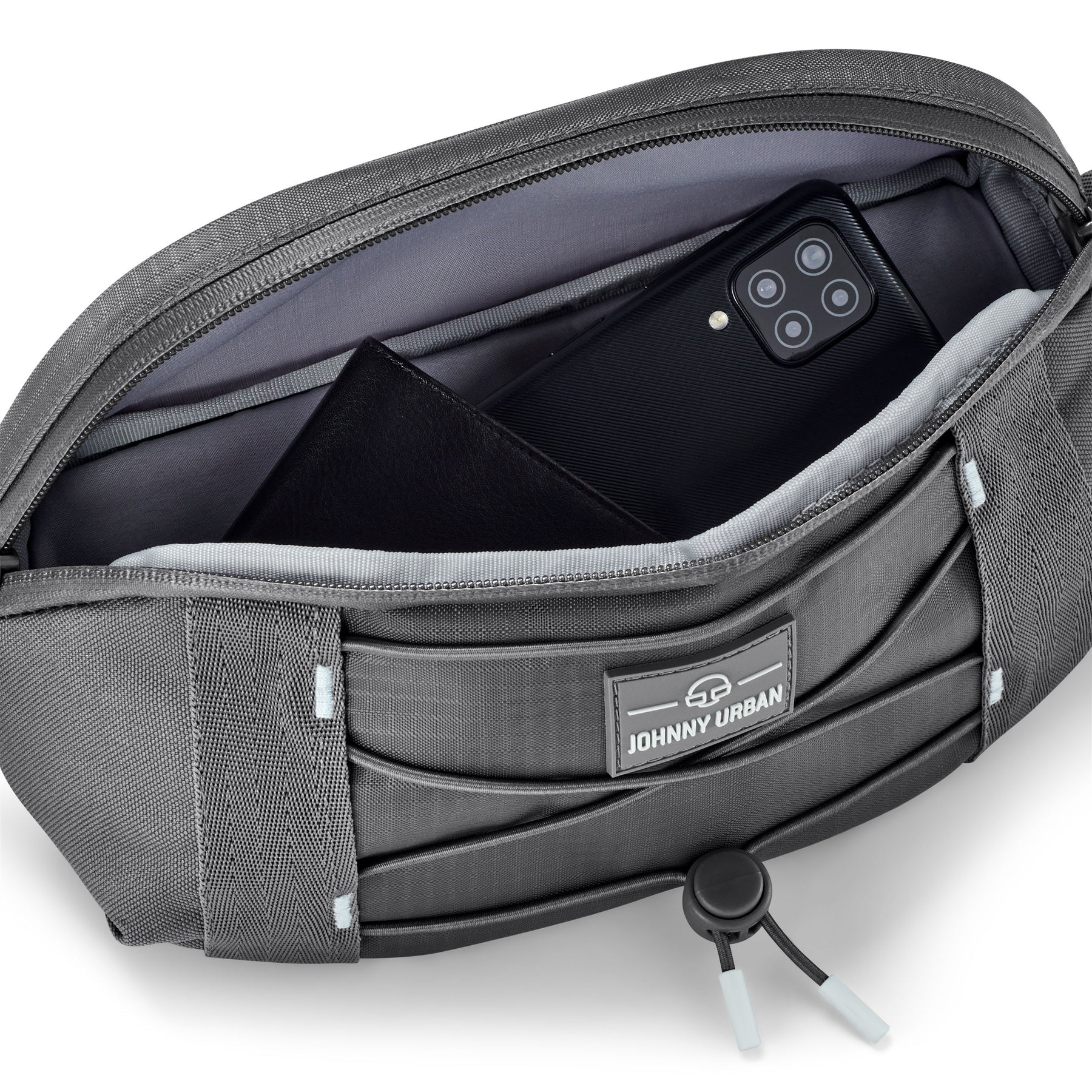 Graue Bauchtasche ‚Devin‘ von Johnny Urban mit geöffnetem Hauptfach, darin Smartphone und Geldbörse