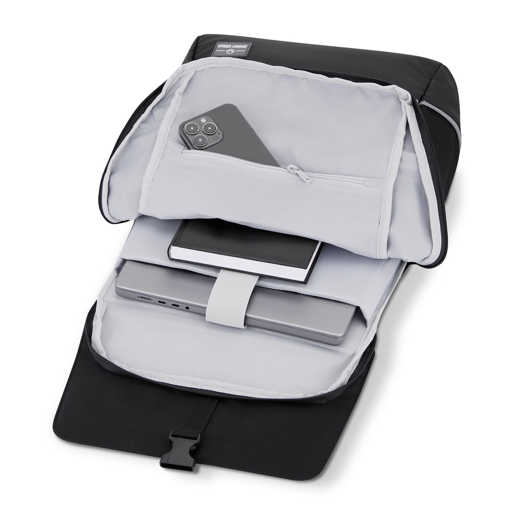 Geöffneter schwarzer Johnny Urban Rucksack 'Mika' mit Laptop, Buch und Smartphone innen