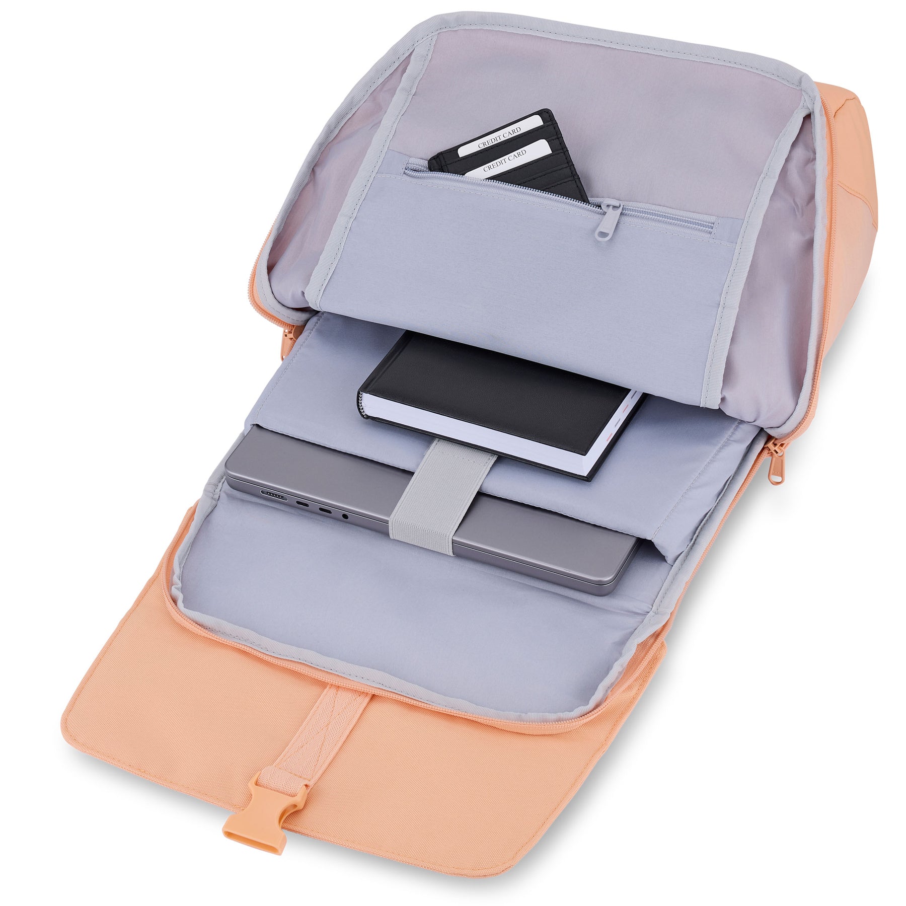 Geöffneter Rucksack 'Mika' mit Laptop, Notizbuch und Kartenfach in Pastellorange