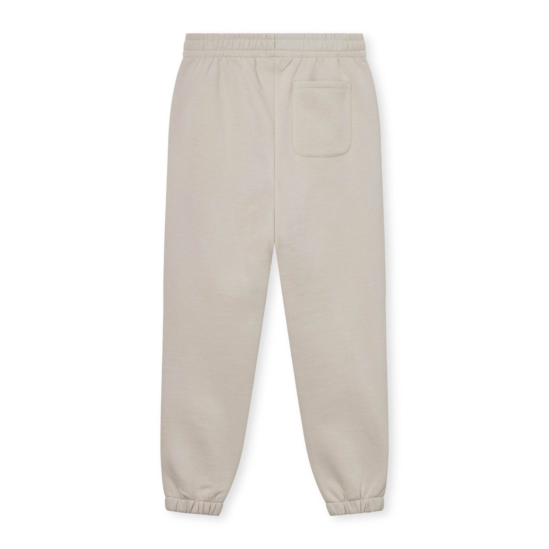 Beige Jogginghose "Owen" unisex mit elastischem Bund und elastischen Bündchen, mit einer Tasche hinten rechts