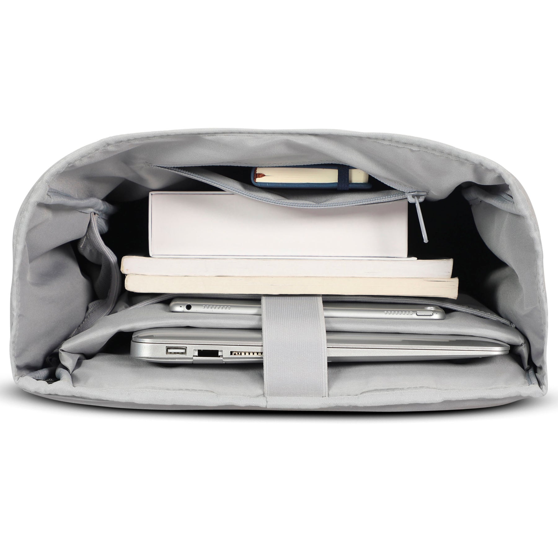 Innenansicht des Rolltop Rucksacks Harvey Large mit Fächern für Laptop, Tablet, Bücher und ein Notizbuch