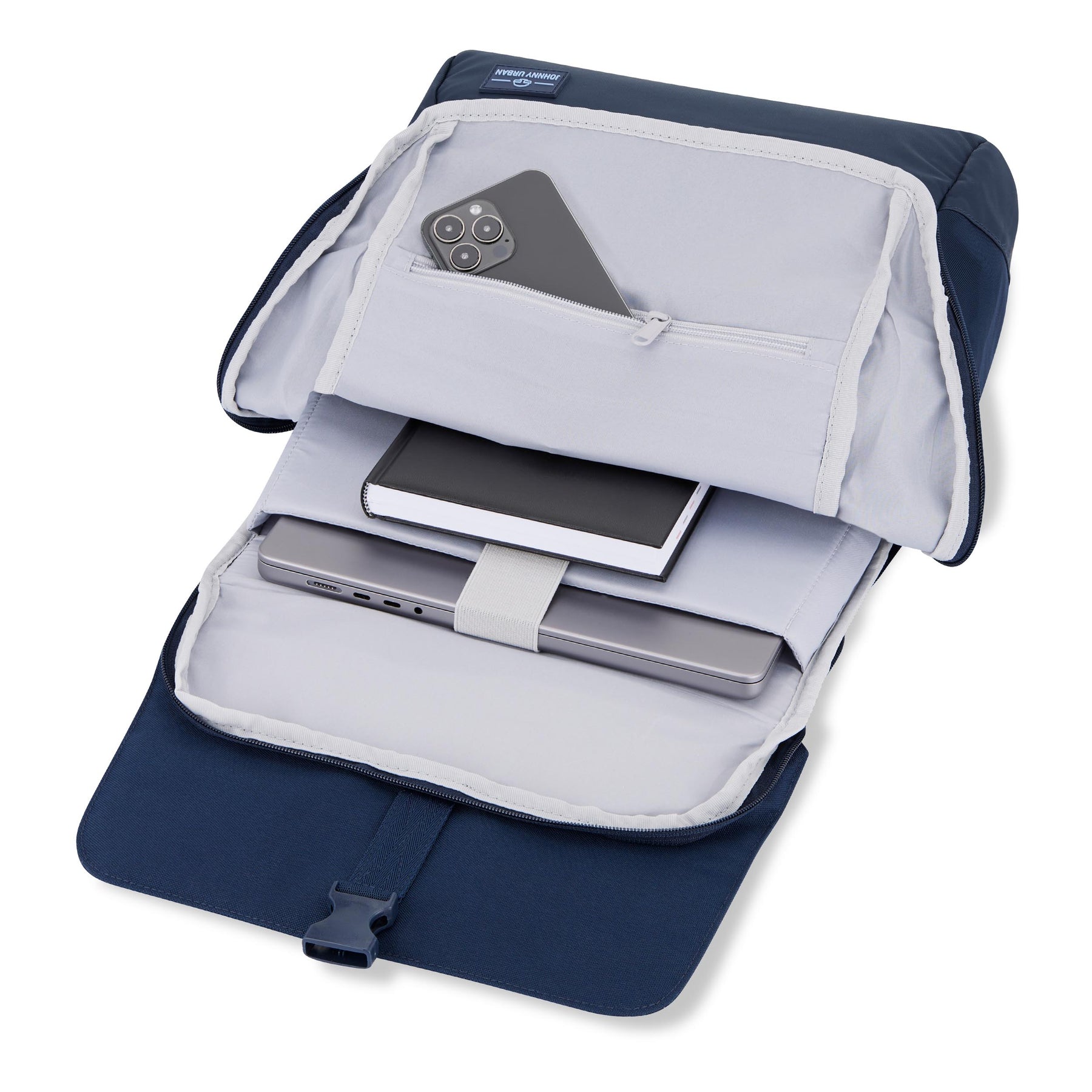 Offener blauer Rucksack 'Mika' von Johnny Urban mit einem Notebook, einem Notizbuch und einem Smartphone in Innenfächern