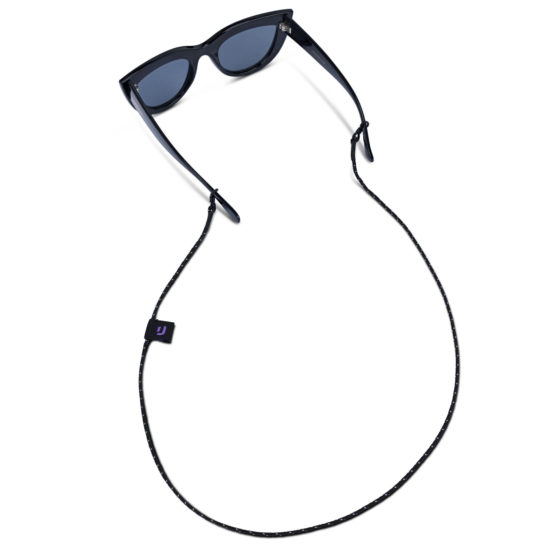 Johnny Urban Sonnenbrillenband 'Jade' Schwarz mit weißen Punkten, an schwarzen Sonnenbrillen befestigt