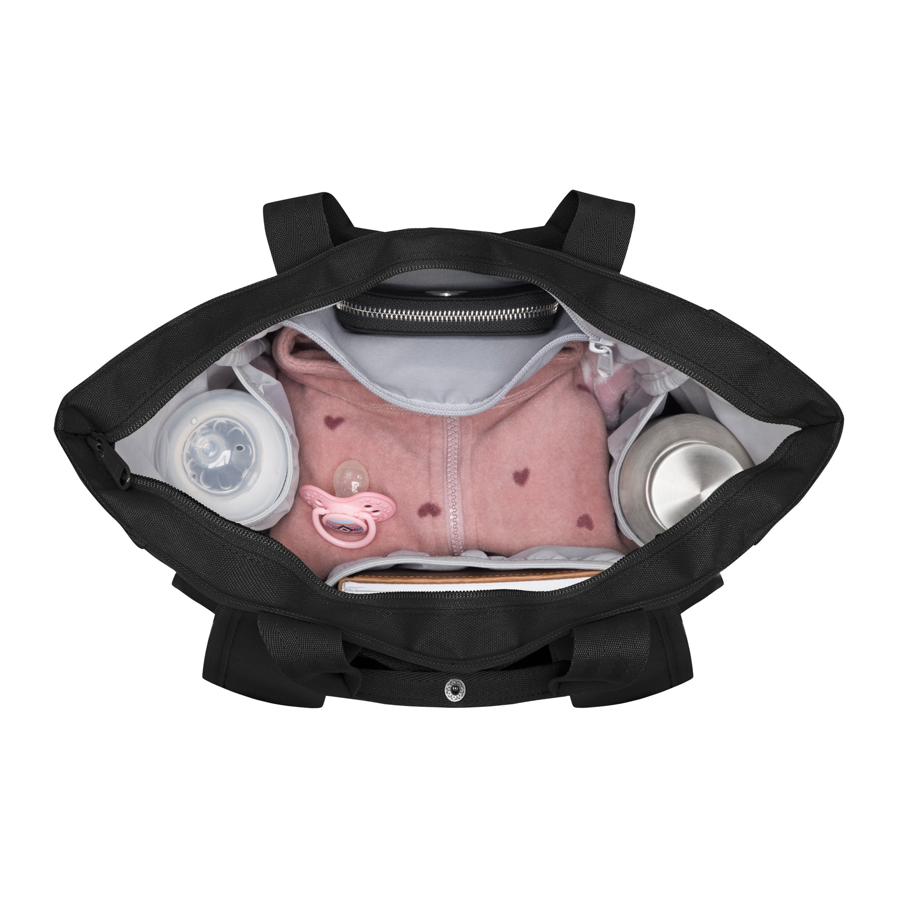 Schwarze Wickeltasche 'Blair' von oben mit rosa Babyjacke, Schnuller, Fläschchen und Thermoskanne im Inneren