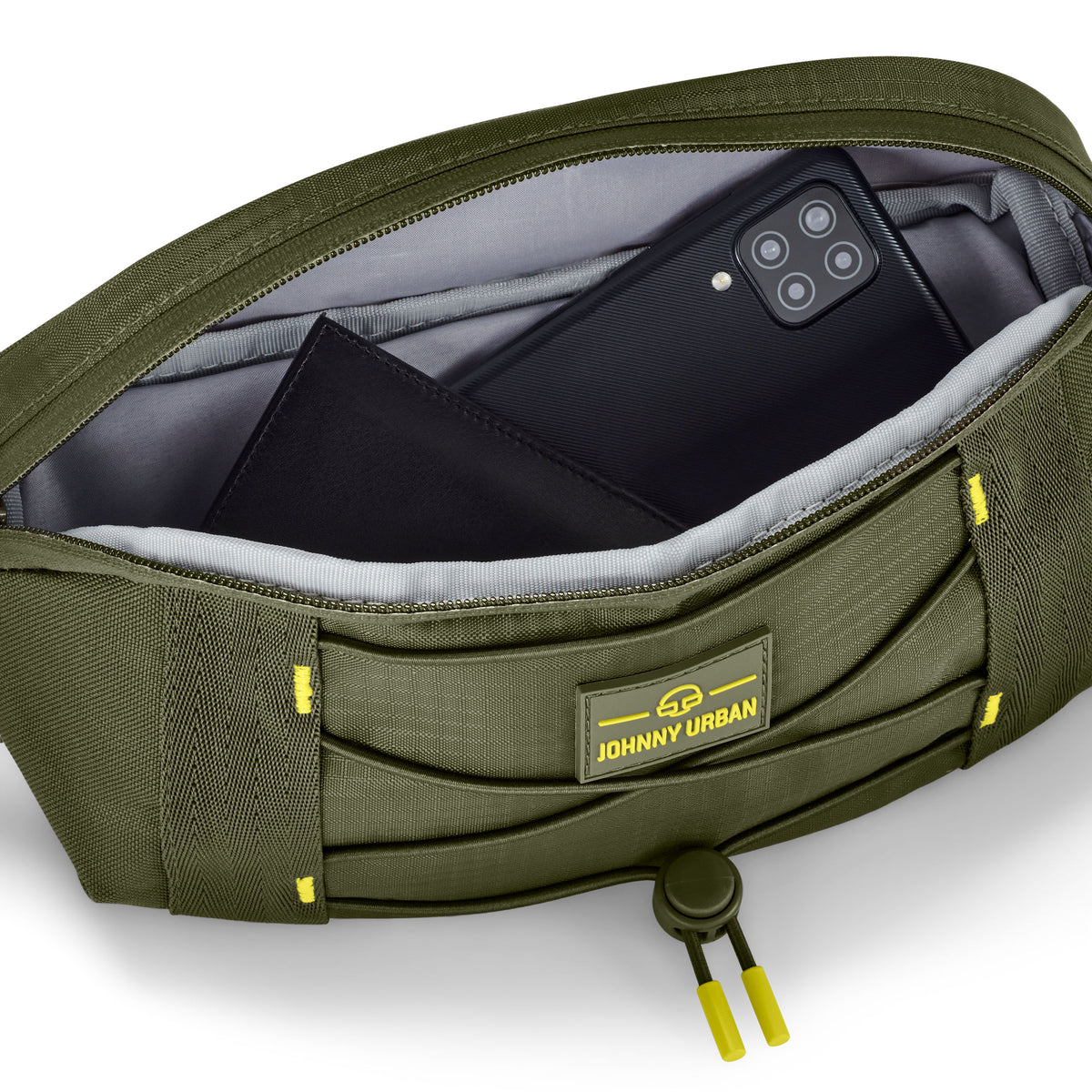 Olivefarbene Bauchtasche 'Devin' von Johnny Urban mit geöffnetem Hauptfach, das ein Smartphone und eine Geldbörse enthält